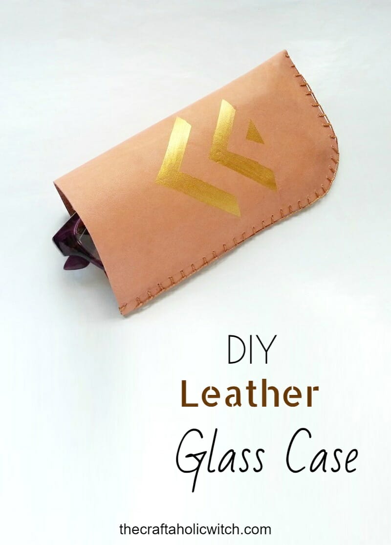 DIY Leather Glass Case - finished project Hand-stitched leather glasses case with a gold geometric design holding a pair of sunglasses