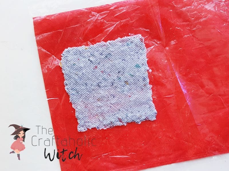 Place the Paper Mache Side on a Non-Sticky Surface Place the Paper Mache Side on a Non-Sticky Surface