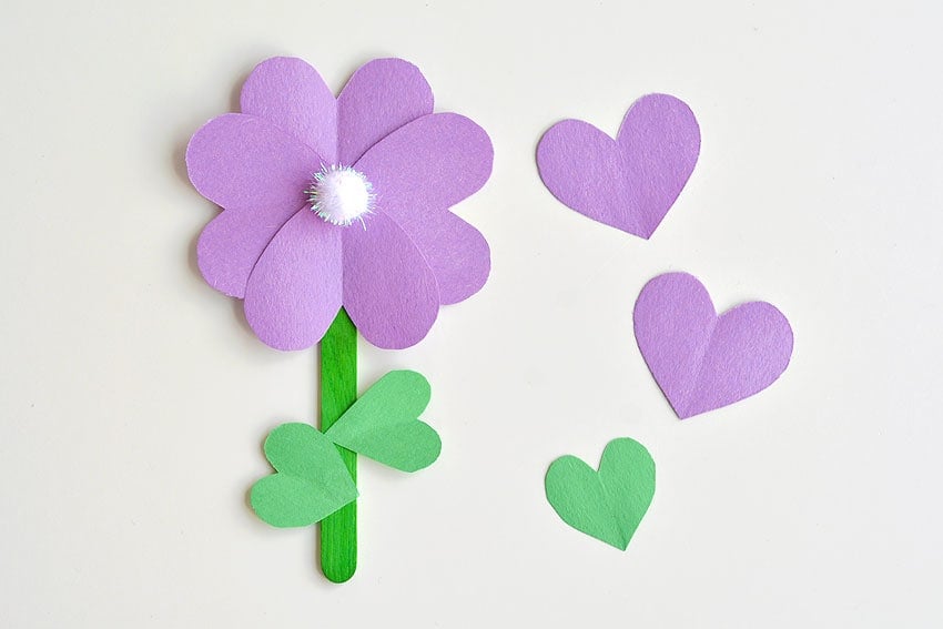 18 Best DIY Construction Paper Crafts (With Full Tutorials) 13 Construction paper flowers made from layered heart shaped petals