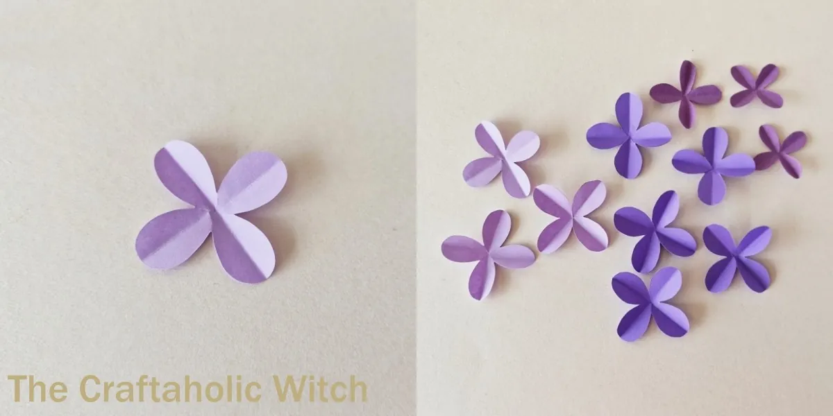 Paper lilac flower craft step 5 Opened paper lilac petals in different purple shades ready for layering