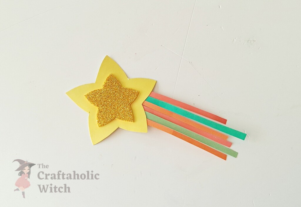Finished star wand pencil topper with pencil inserted through pocket opening