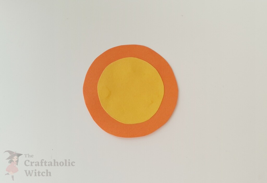 Easiest Paper Butterfly for Kids (with Free Template) 4 Small colored circle glued to center of large paper circle for layered wing design