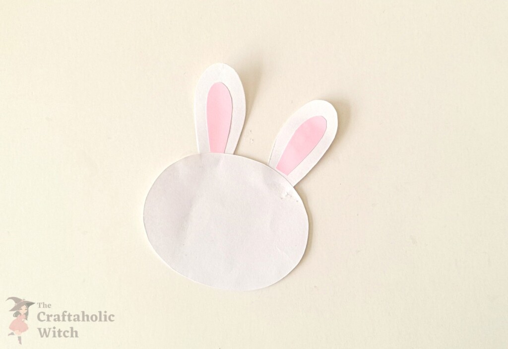 Bunny ear pieces being glued onto the bunny head base cutout