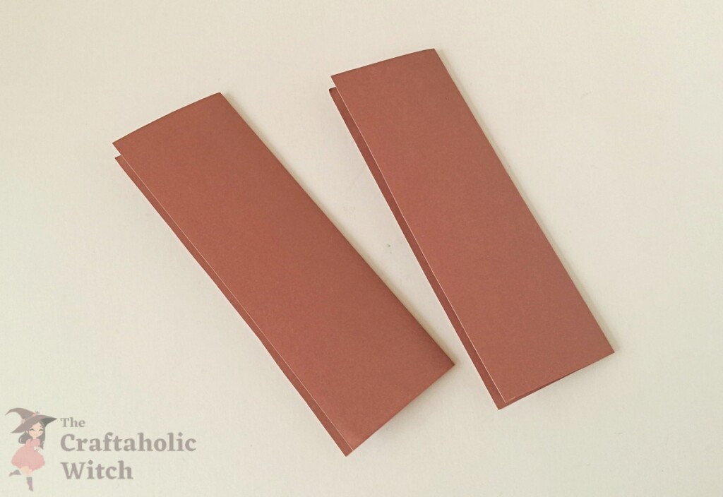 Ramadan decor step 2 - fold in half Craft paper sheet folded in half lengthwise for the layered Ramadan decoration