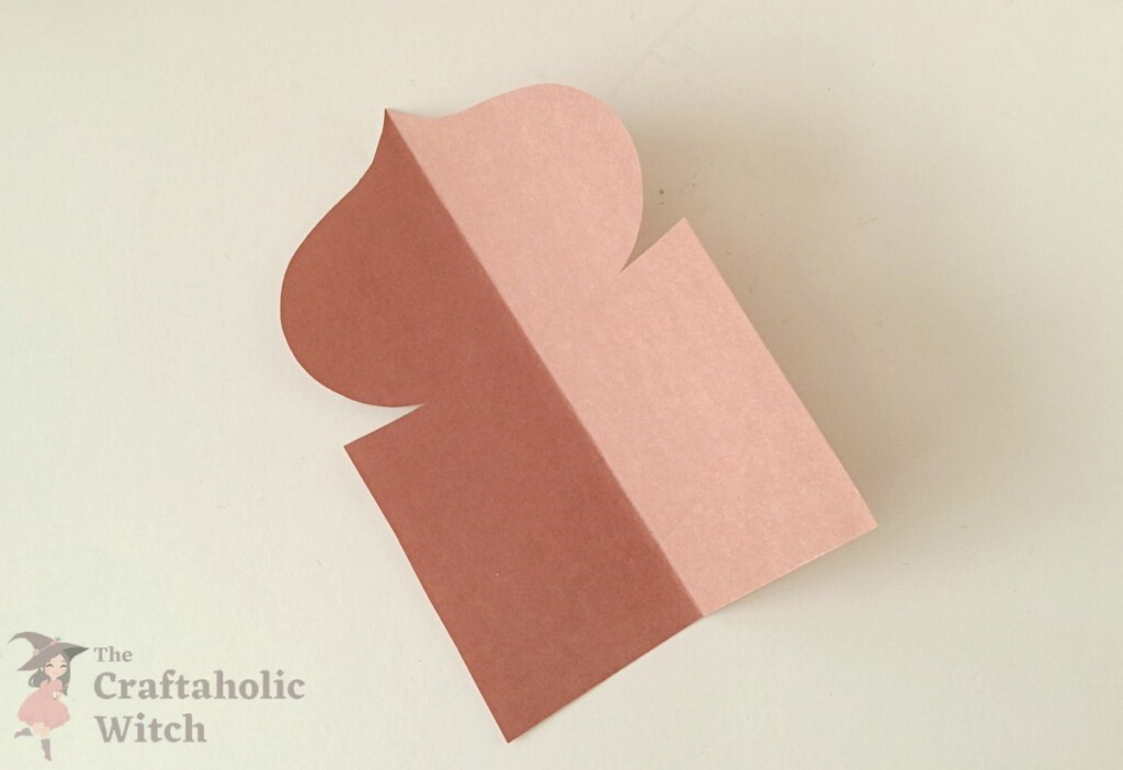 Ramadan decor step 6 - unfold pattern One dome-shaped paper cutout unfolded to show the symmetrical pattern