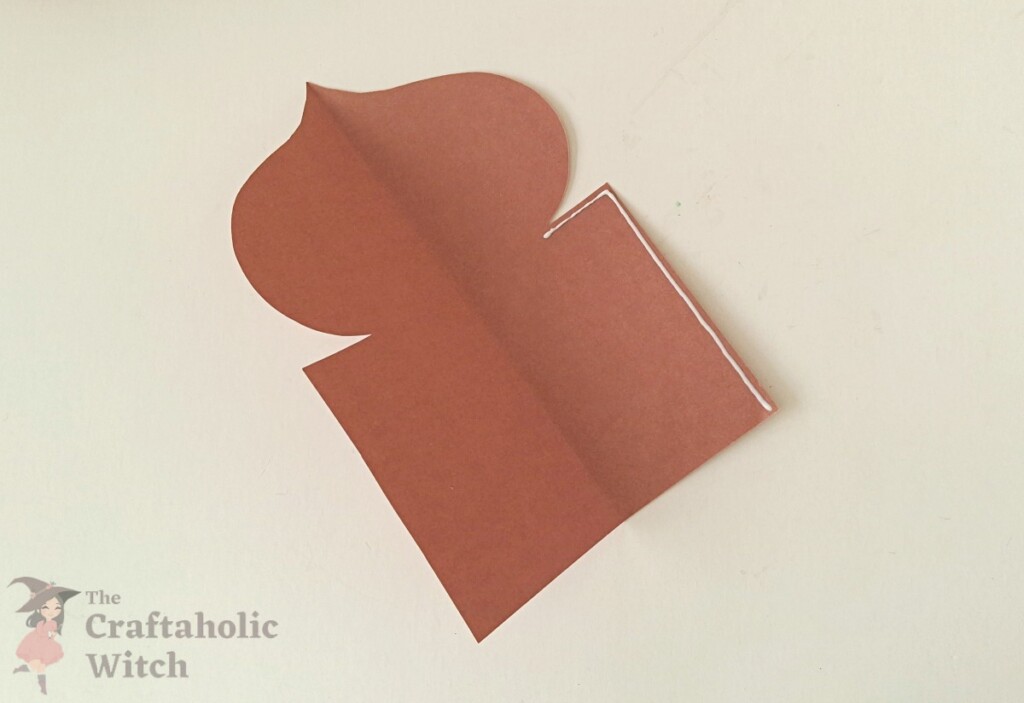 Ramadan decor step 7 - apply glue Craft glue applied along the straight side below the dome on the unfolded paper pattern