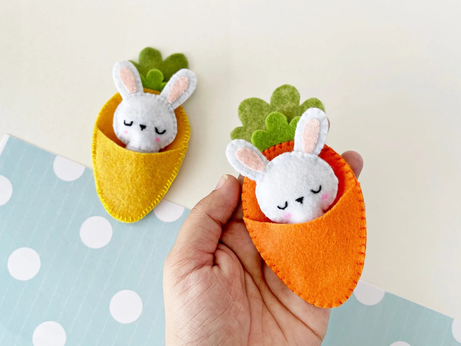Finished felt bunny tucked inside a felt carrot pocket with a green leaf top