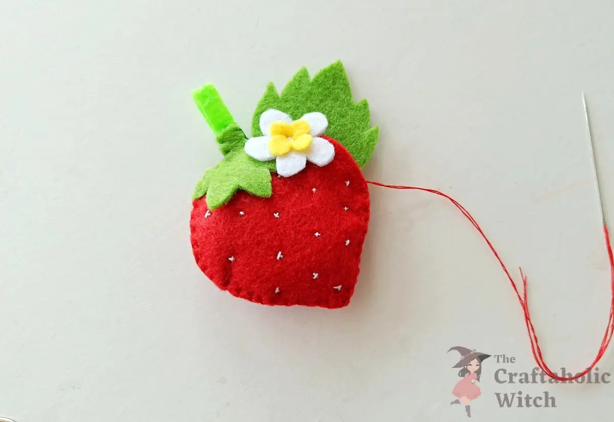 Stuffed felt strawberry keychain shape finished before adding the ring