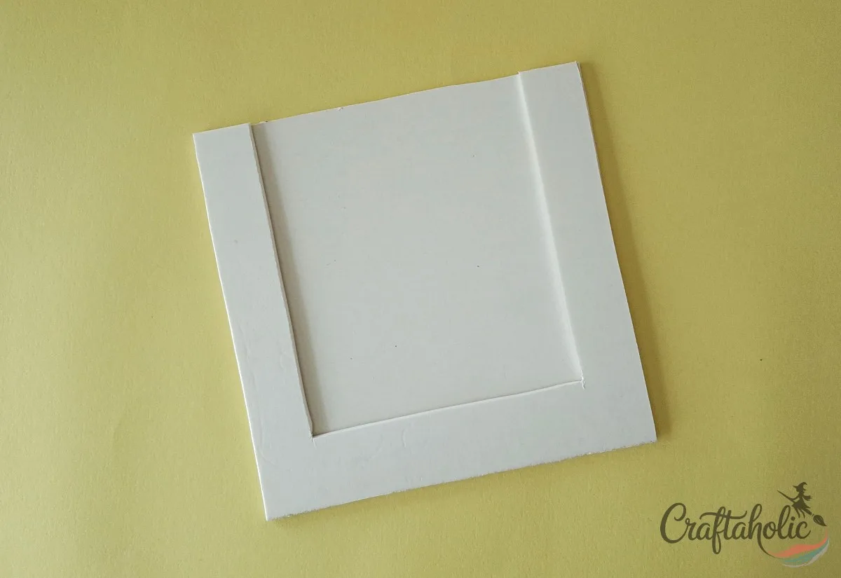 Attach the back and middle layers Gluing the back and middle cardboard layers together for the photo frame