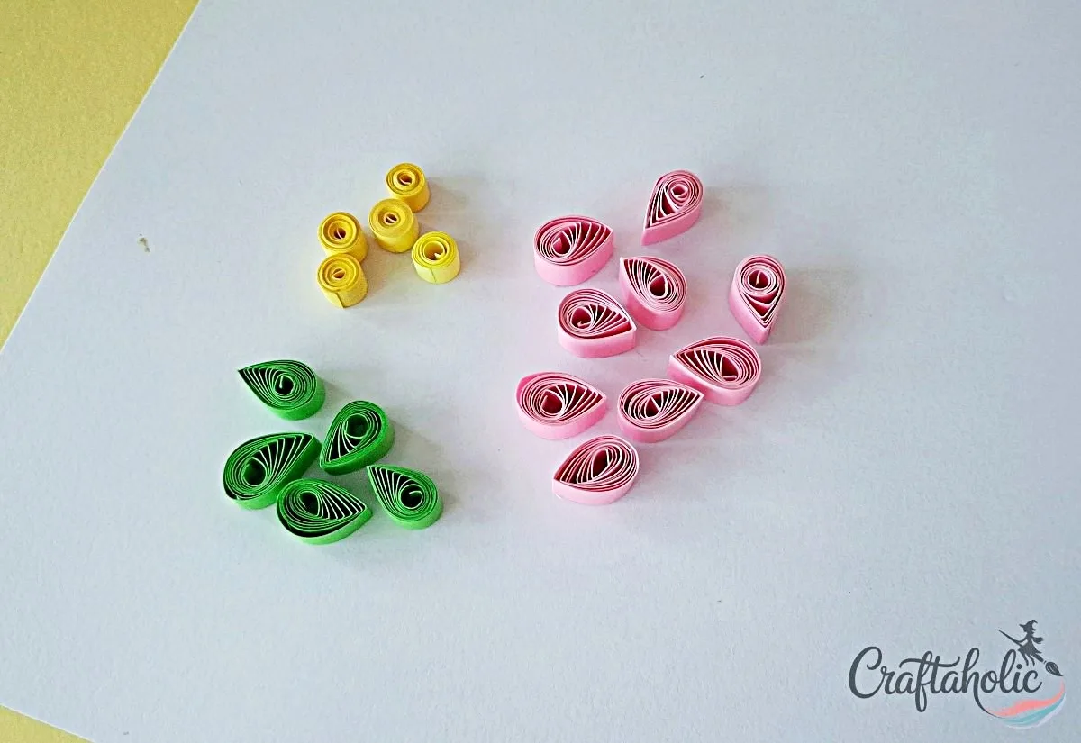 Prepare teardrop petals Colorful quilled teardrop shapes prepared for flower petals