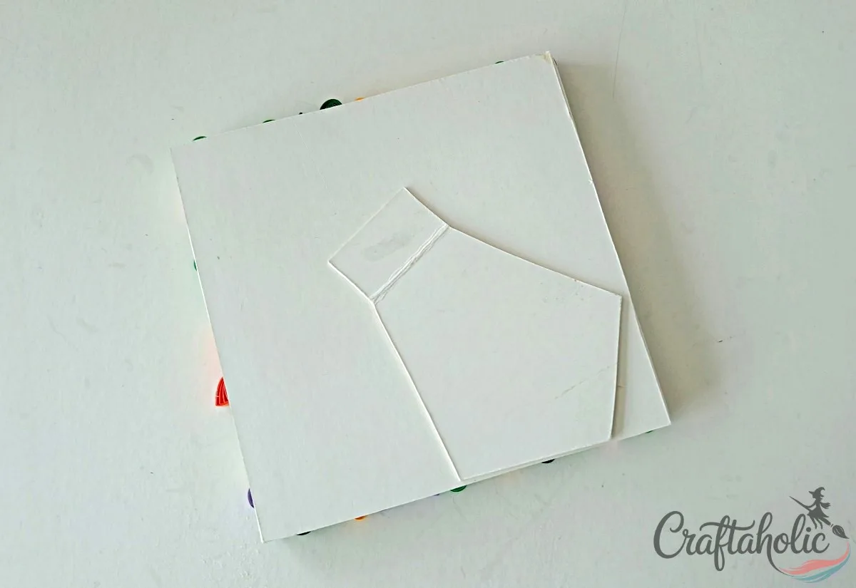 Attach the stand Attaching a cardboard stand to the back of the paper quilling photo frame