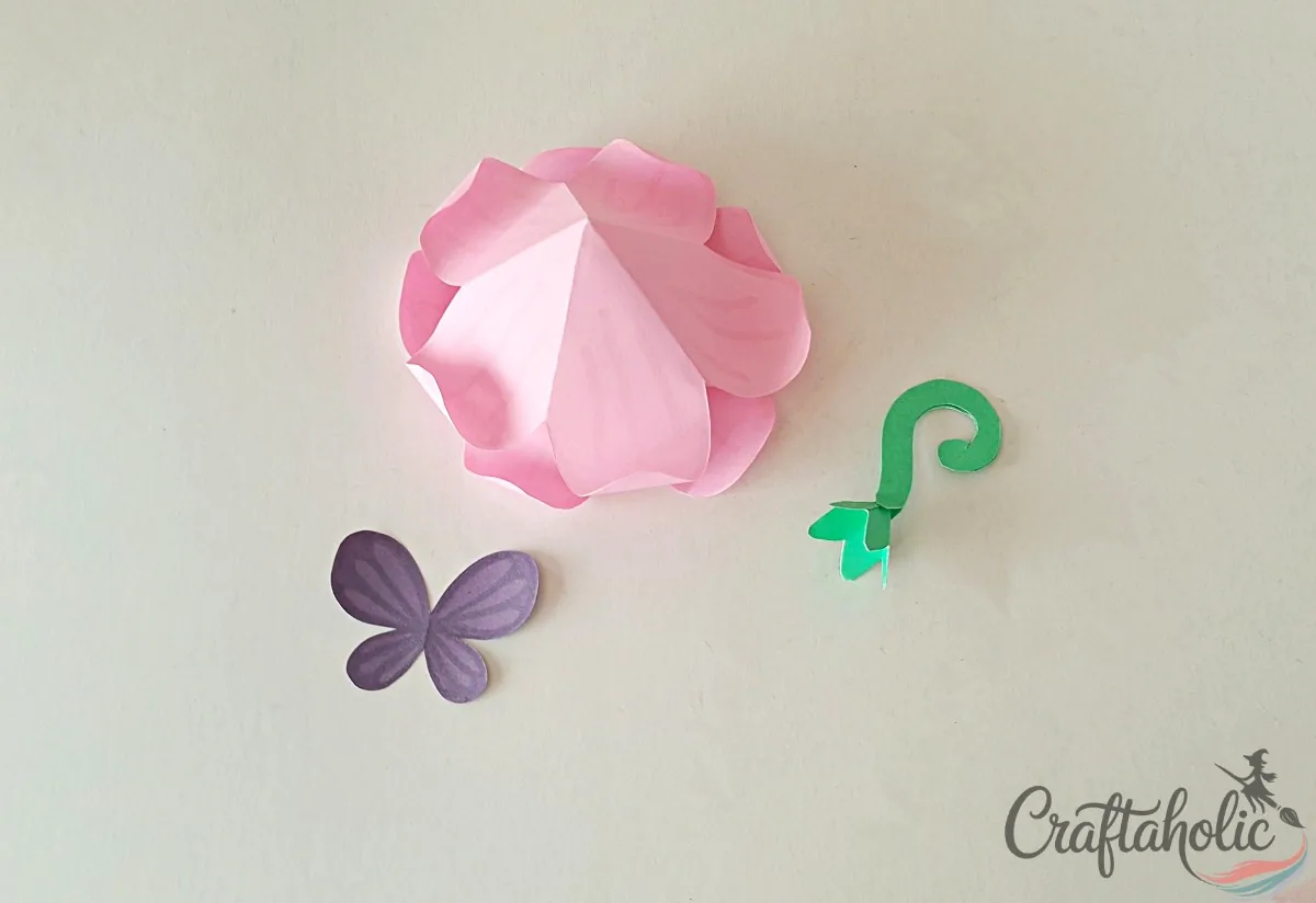 Gluing the flower roof layers one on top of the other