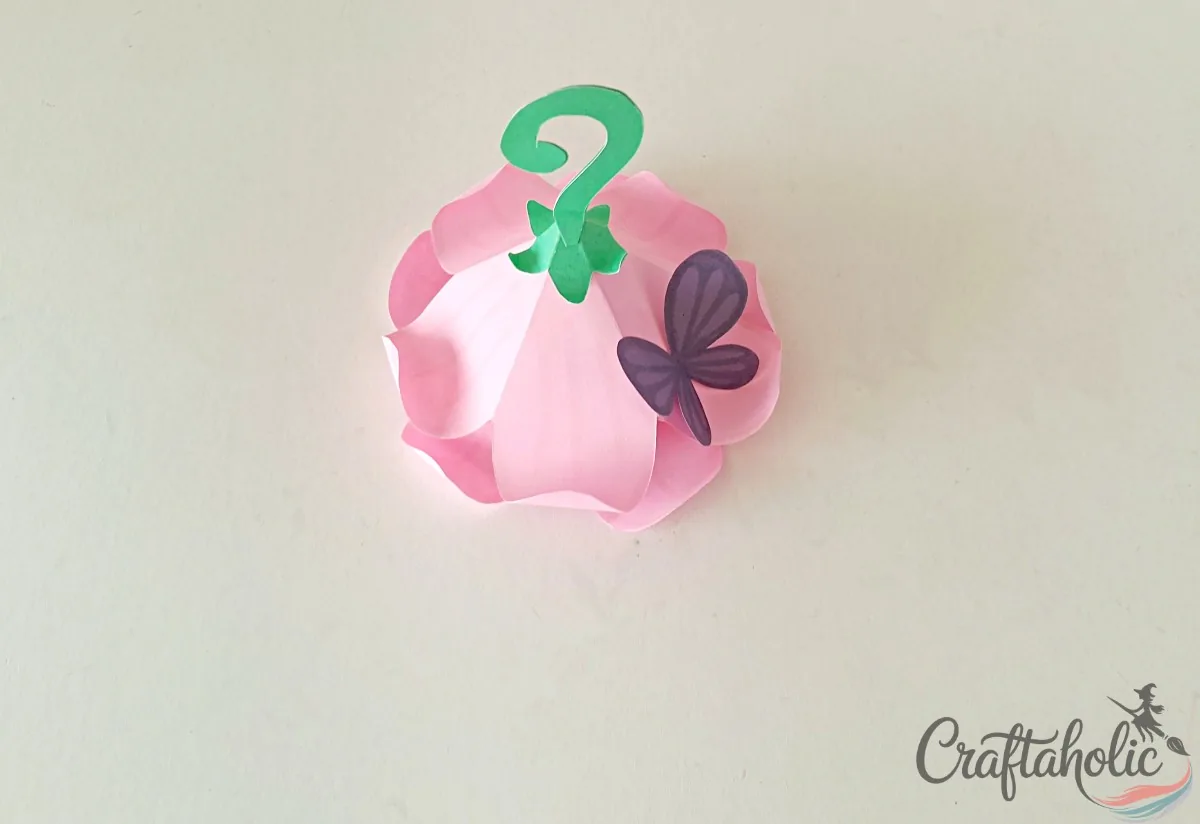 Attaching the cup-stem and butterfly to complete the fairy house flower roof