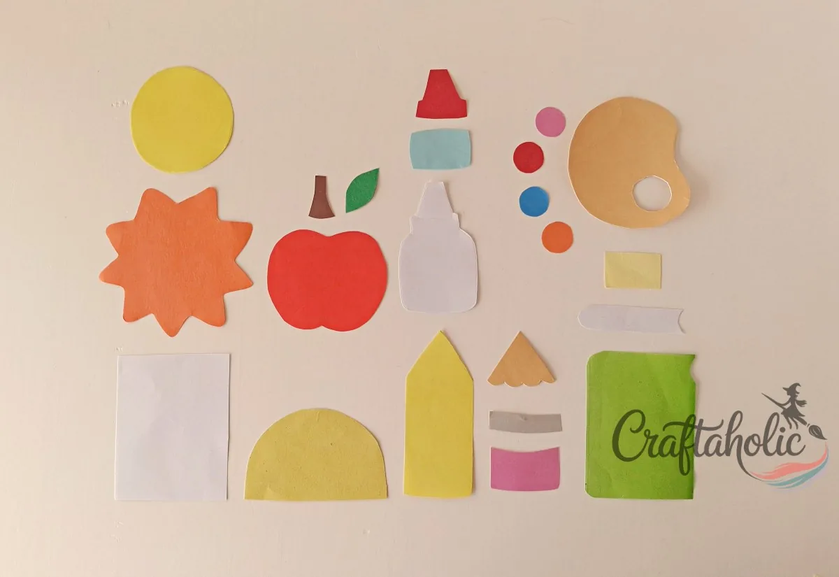 Tracing and cutting the garland patterns Printed template patterns traced and cut from colored craft paper for the back to school paper garland