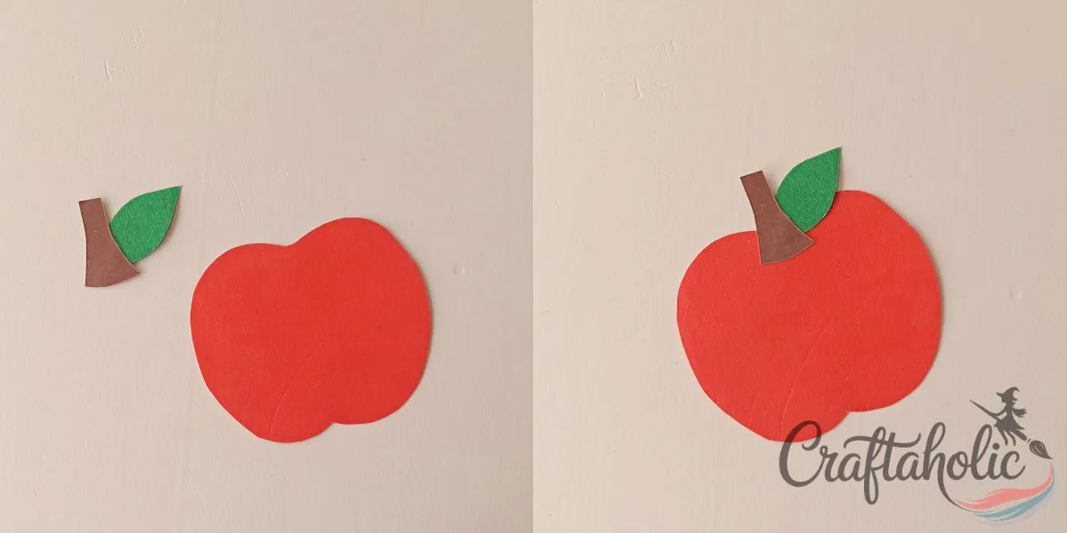 Assembling the paper apple banner Gluing paper leaf and stem cutouts onto an apple base to craft the paper apple banner