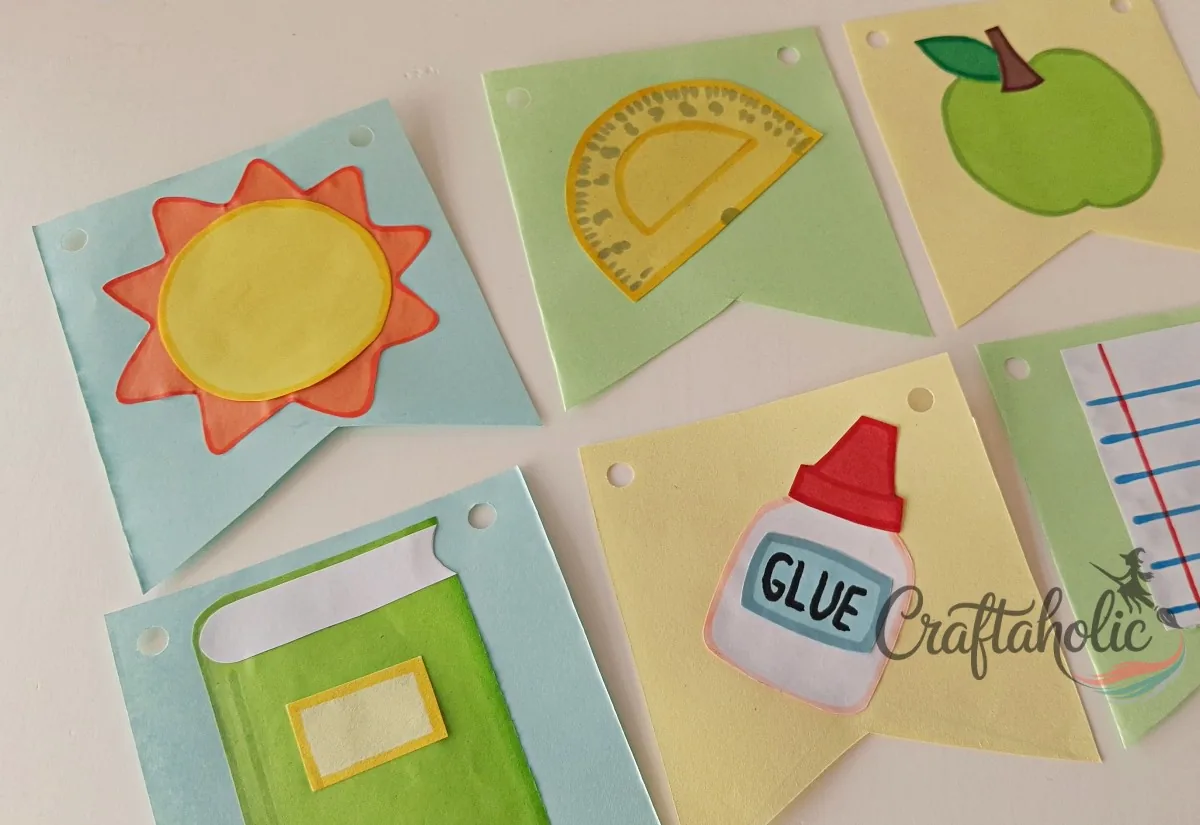 Punching holes in the bunting flags Punching holes on both top edges of the paper bunting with a paper punch