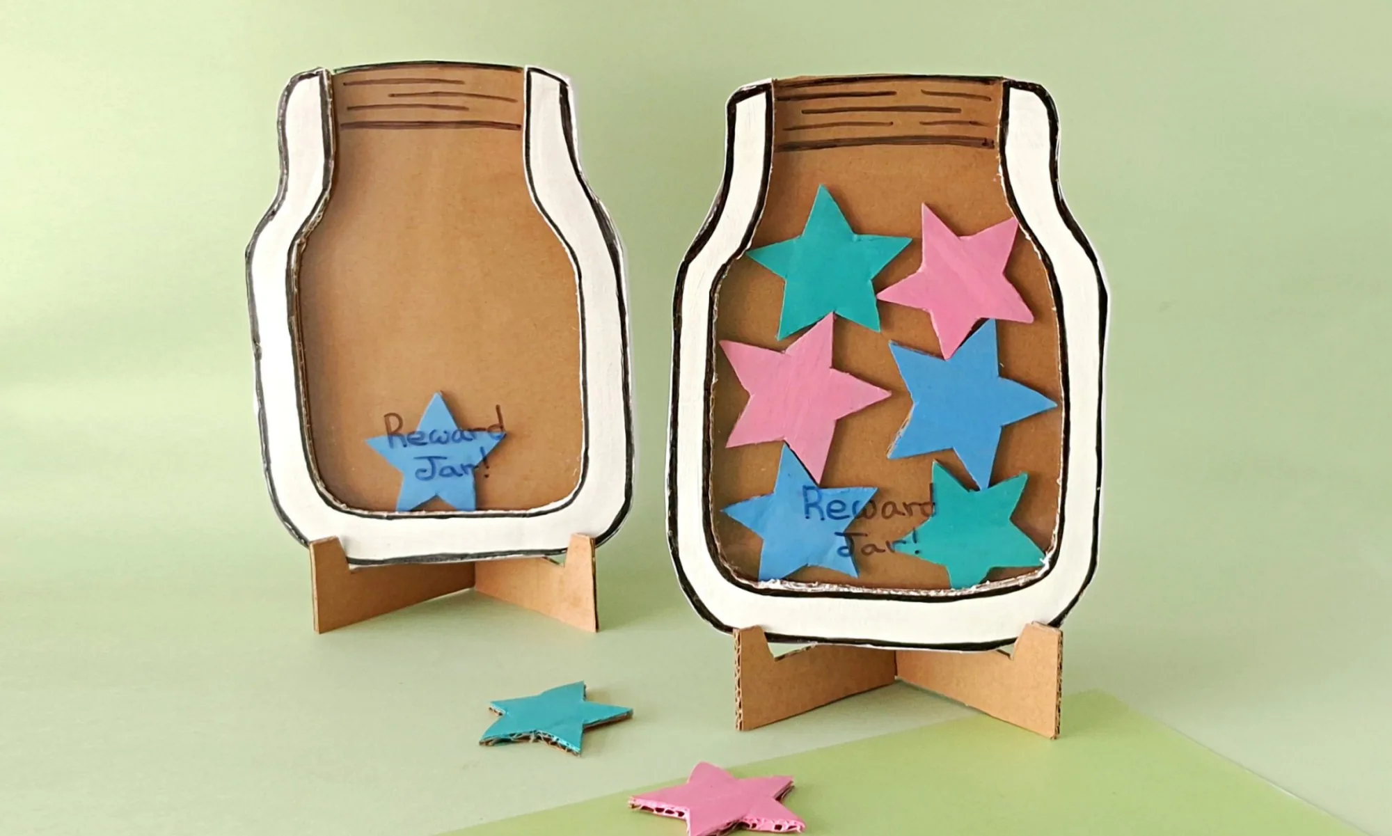 Finished classroom reward jar with painted cardboard stars Finished DIY classroom reward jar craft with colorful cardboard stars