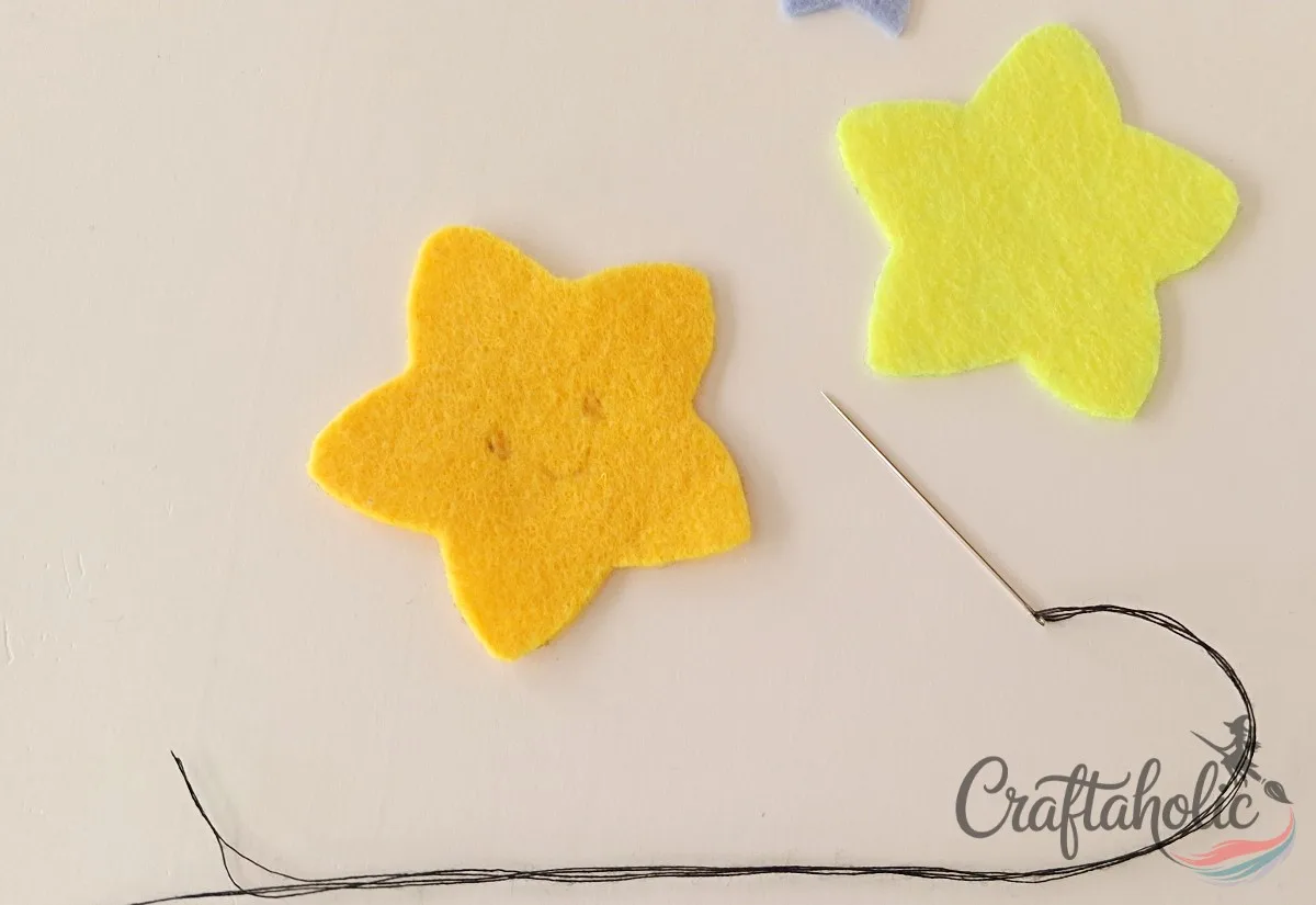 Drawing the star face outline before stitching a felt pencil topper