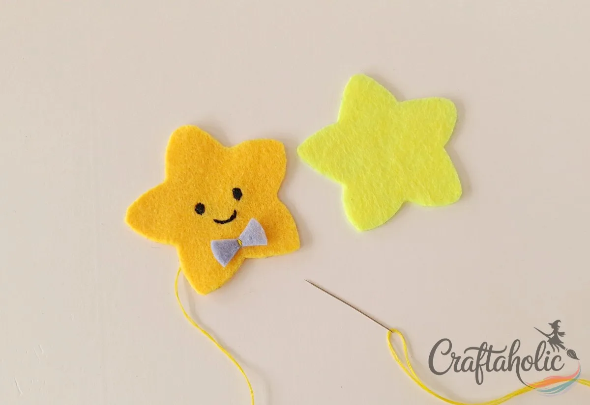Attaching the felt bow and joining the two star layers together