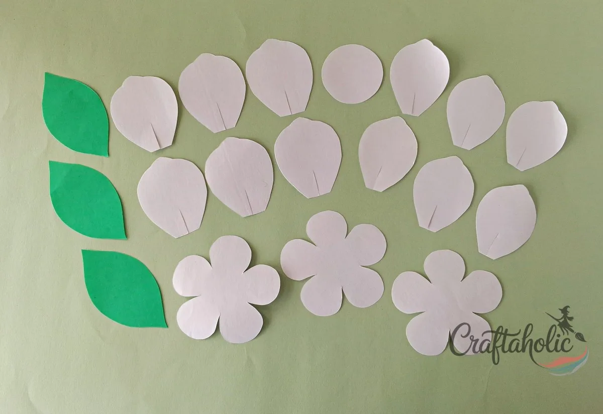 How to Make a Realistic Paper Gardenia Flower 2 Tracing and cutting realistic paper gardenia petal, leaf, and base patterns from a template