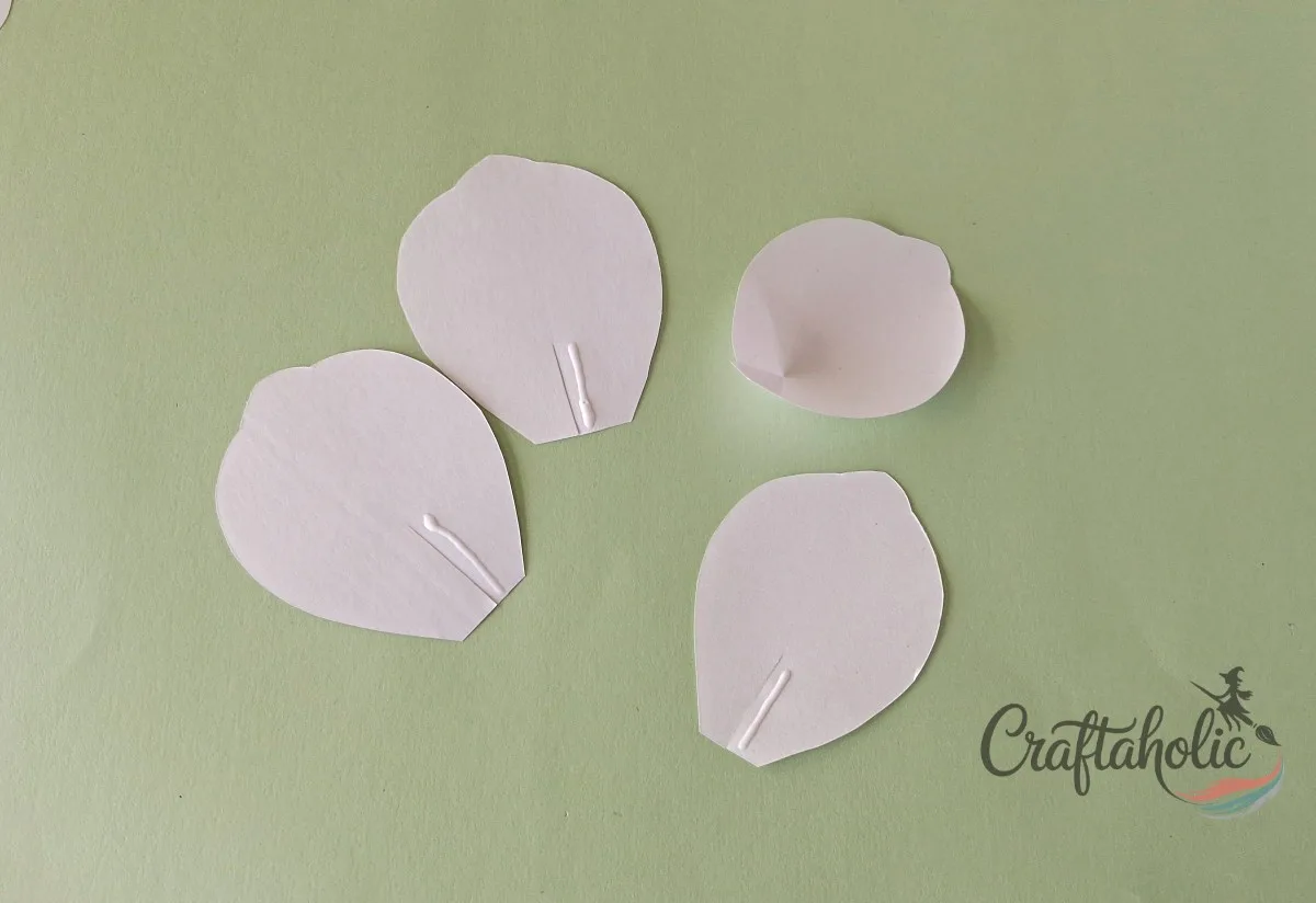 How to Make a Realistic Paper Gardenia Flower 3 Cutting a center slit into each paper gardenia petal cutout