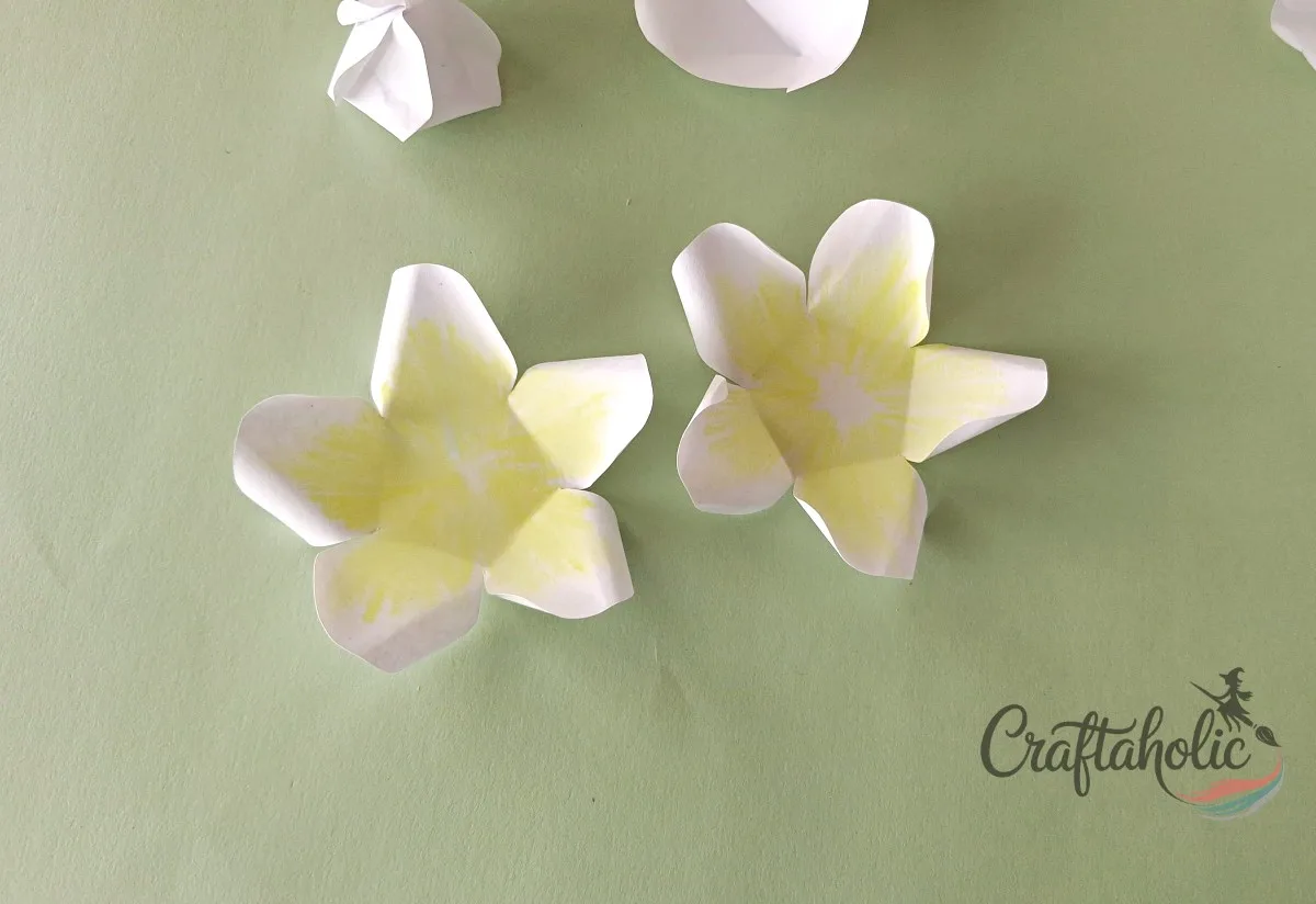 How to Make a Realistic Paper Gardenia Flower 12 Curling the two yellow-centered paper gardenia petal sets