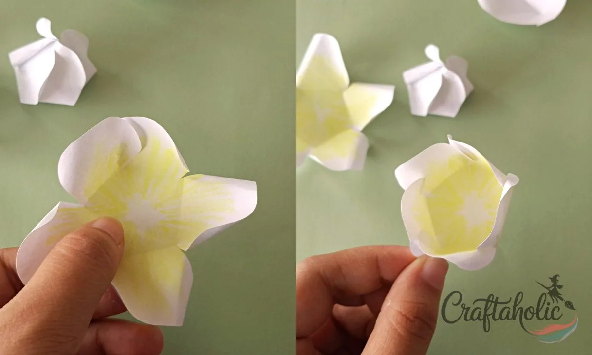 How to Make a Realistic Paper Gardenia Flower 13 Spiraling a yellow-centered paper gardenia petal set while leaving space in the center