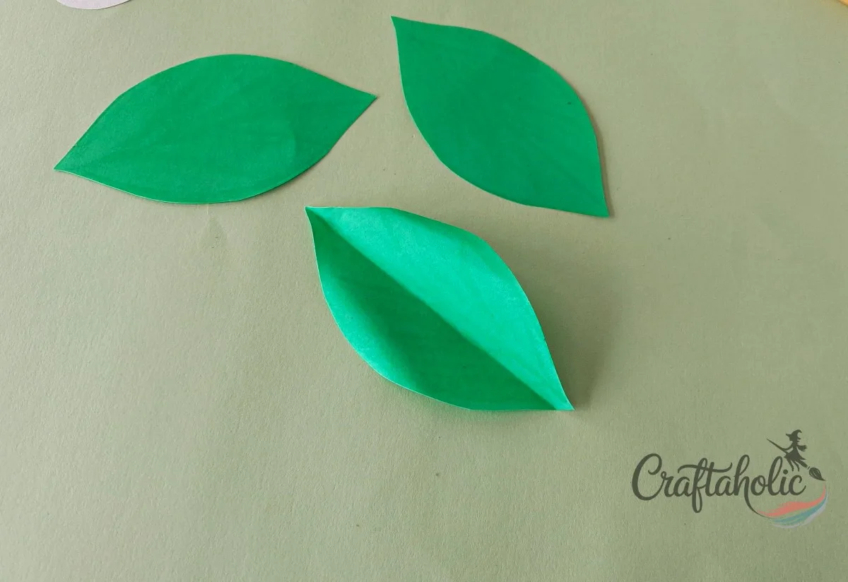 How to Make a Realistic Paper Gardenia Flower 21 Curling the edges of the paper gardenia leaves with a craft stick