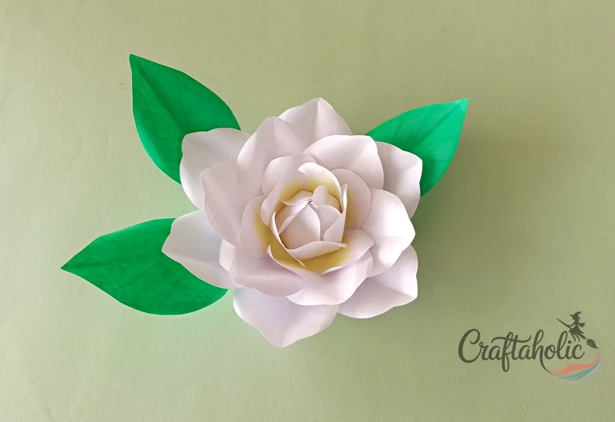 How to Make a Realistic Paper Gardenia Flower 22 Gluing paper leaves onto the finished realistic paper gardenia flower