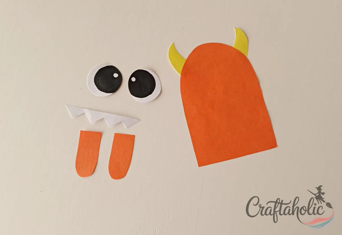 DIY Monster Bookmarks (Easy Paper Craft for Kids) 4 Mixing and matching horn, teeth, and eye patterns for a paper monster bookmark