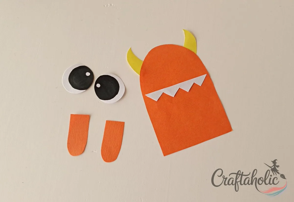 DIY Monster Bookmarks (Easy Paper Craft for Kids) 5 Gluing the zigzag teeth cutout onto the monster bookmark base