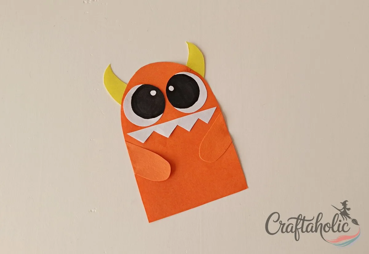 DIY Monster Bookmarks (Easy Paper Craft for Kids) 8 Attaching both arms and trimming the edges of the paper monster bookmark