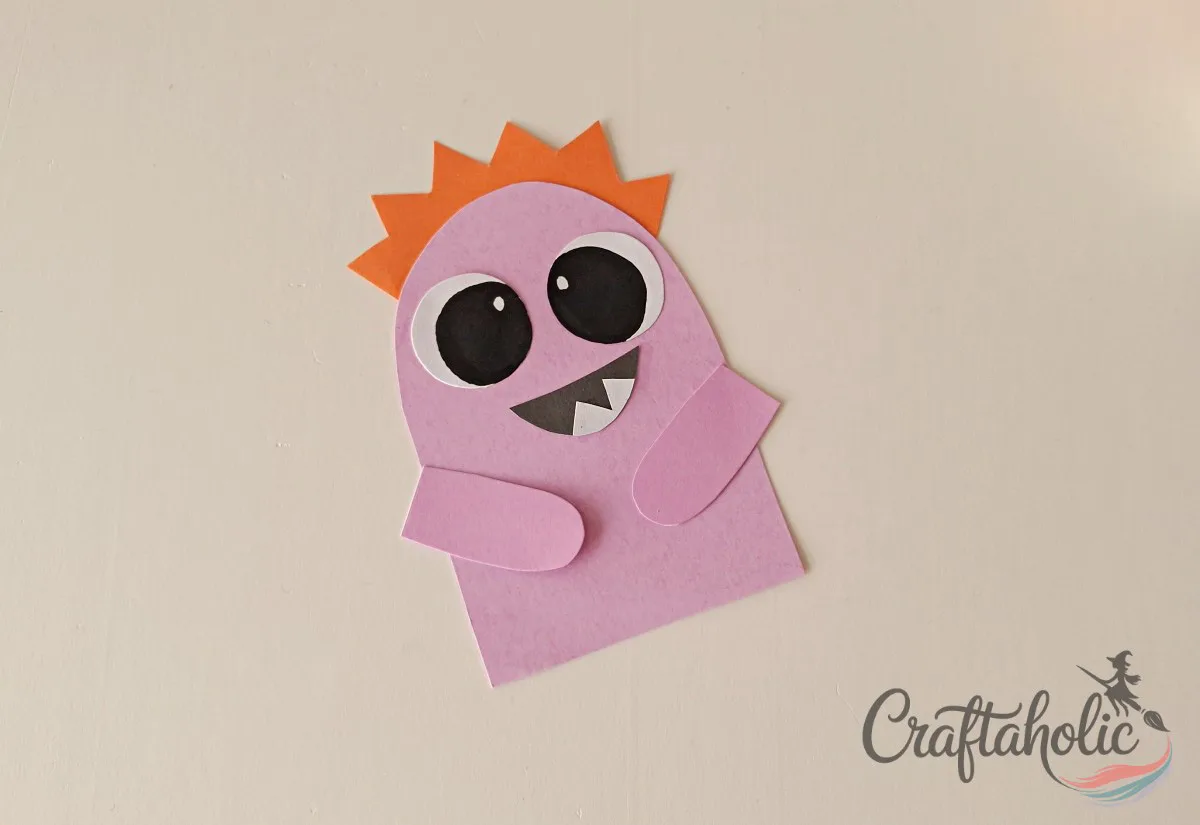 DIY Monster Bookmarks (Easy Paper Craft for Kids) 12 Attaching both arms to the second paper monster bookmark