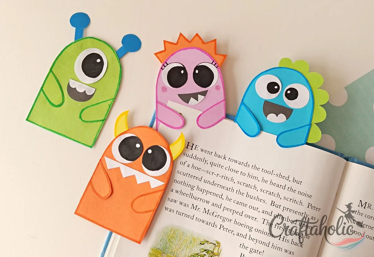 DIY Monster Bookmarks (Easy Paper Craft for Kids) 14 Using a finished paper monster bookmark by slipping it under a book page