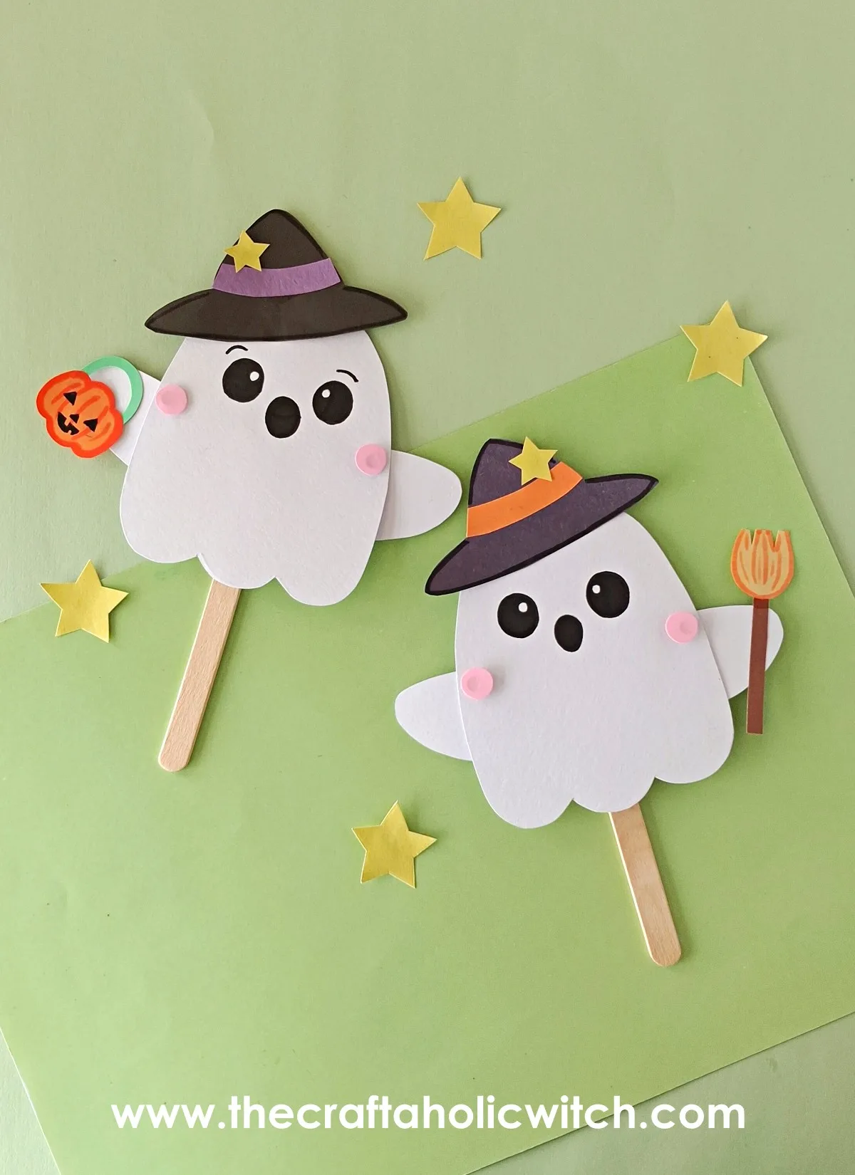 Moving ghost puppet duo Two paper moving ghost puppets with witch hats and Halloween stars