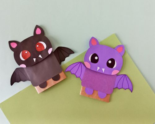 20 Easy Halloween Paper Crafts for Kids to Make at Home 5 Paper bag bat puppet: black paper bat with wings made from a folded paper lunch bag
