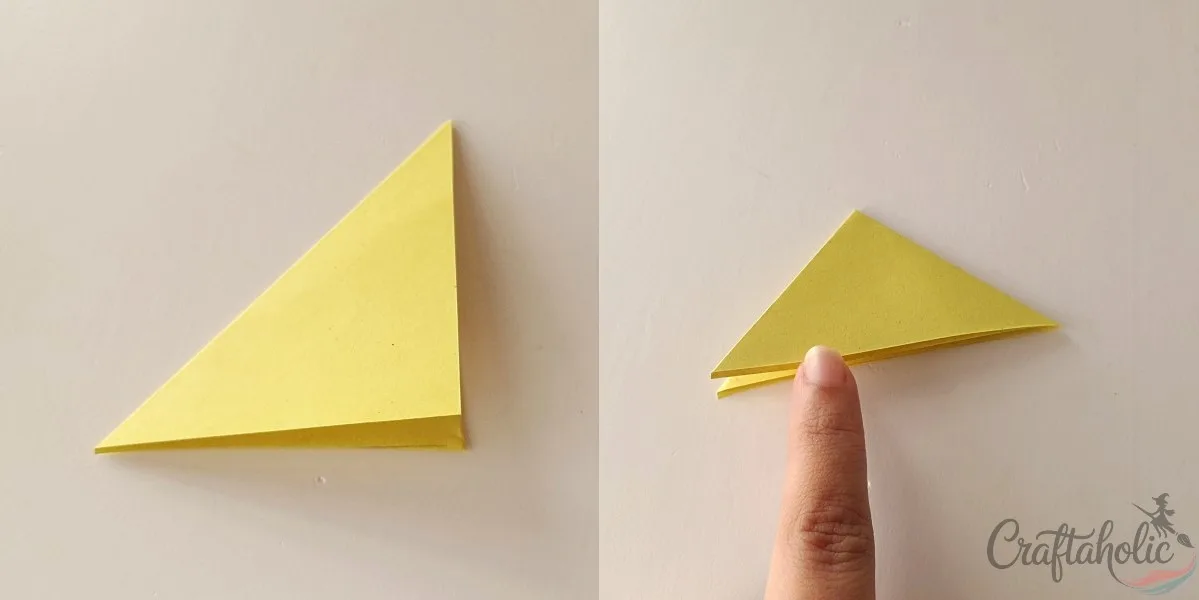 Folding paper marigold petal paper in half twice diagonally