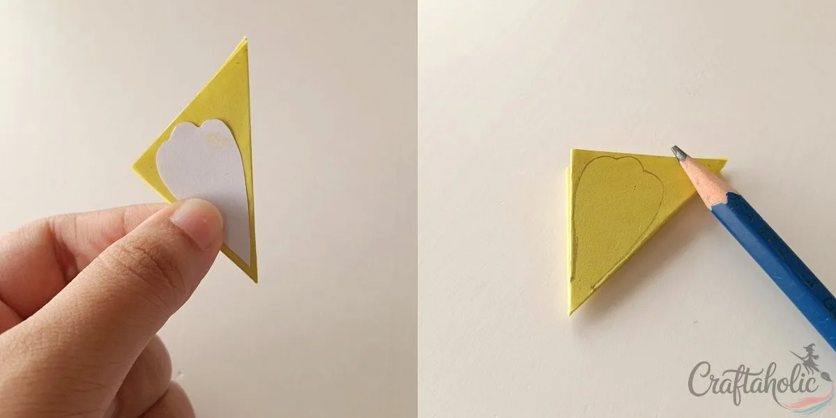 Tracing the paper marigold petal template onto folded paper