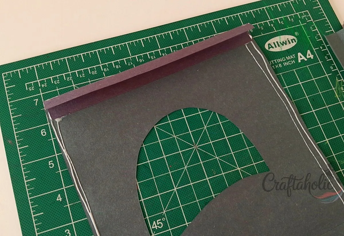 Attaching a spacer strip to the First Layer Attaching a folded strip along a glued side of the first layer