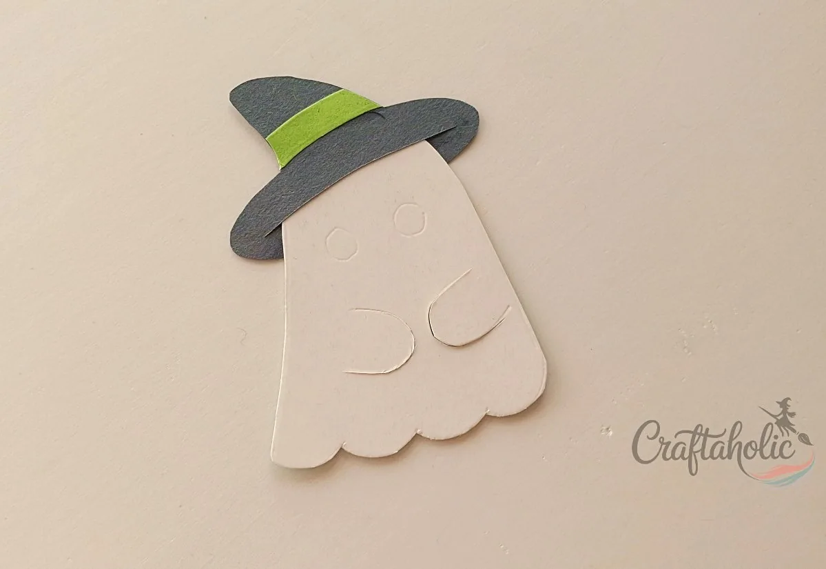 Attaching the hat to Ghost 1 Witch hat attached to the first ghost lollipop holder pattern