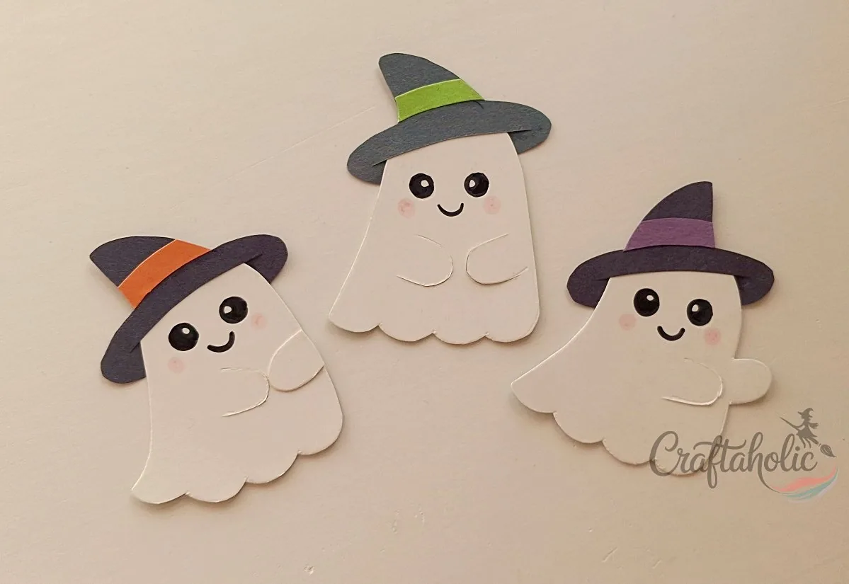 Drawing the ghost faces Ghost faces drawn on with markers