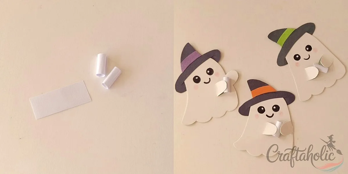 Rolling the lollipop sleeve Rolled paper cylinders glued between the ghost's arms to hold the lollipop stick