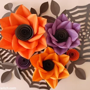 Finished Halloween flower wall art with paper flowers, leaf branches and spider webs
