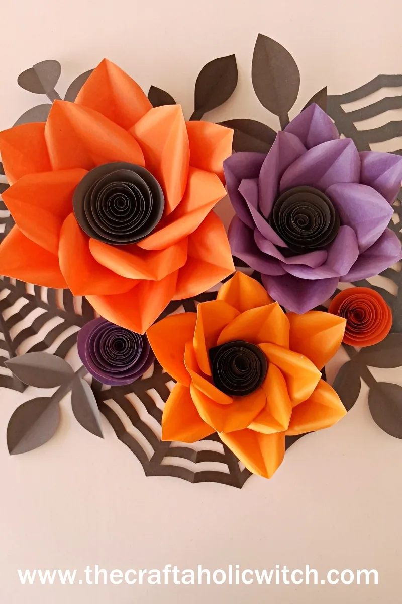 Halloween flower wall art made from colored cardstock paper flowers