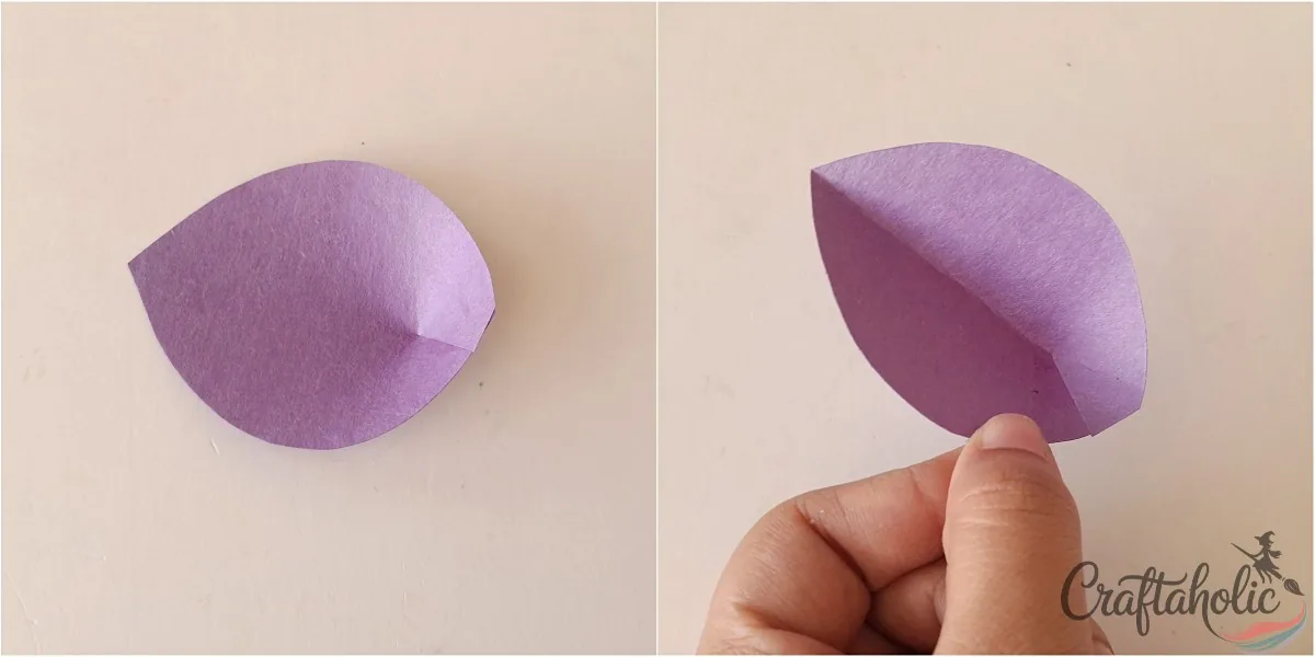 Overlapping the slit sides of the paper petal to secure them with glue