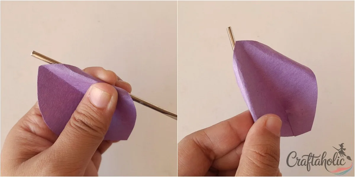 Curling the sides of a paper petal with a crochet hook