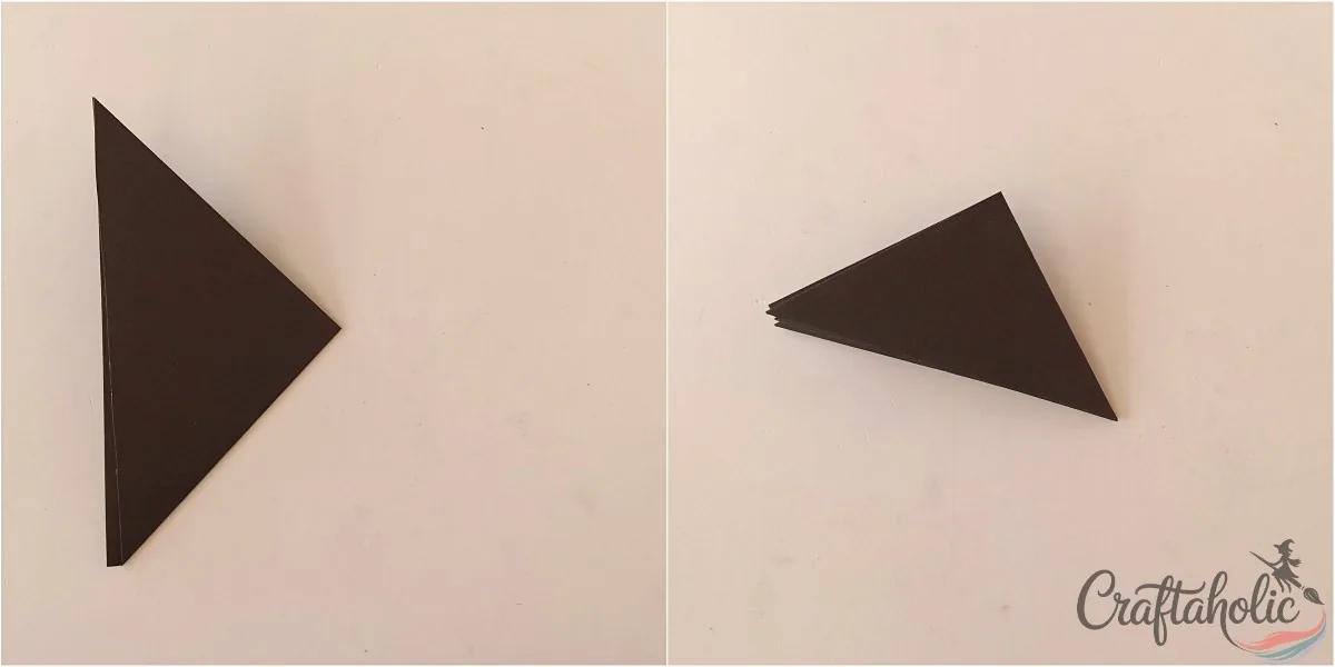 Folding the paper in half two more times for the spider web