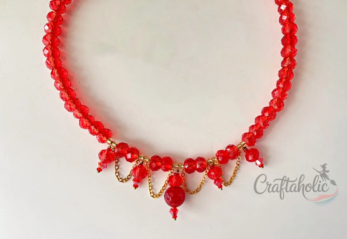 Blood-red beaded choker necklace, finished Finished red beaded choker necklace with dangling crystal chain detail
