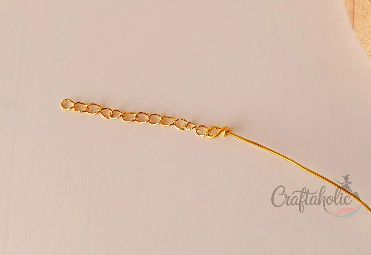Beaded choker necklace, step 6 Coiling the base wire to secure the closure chain