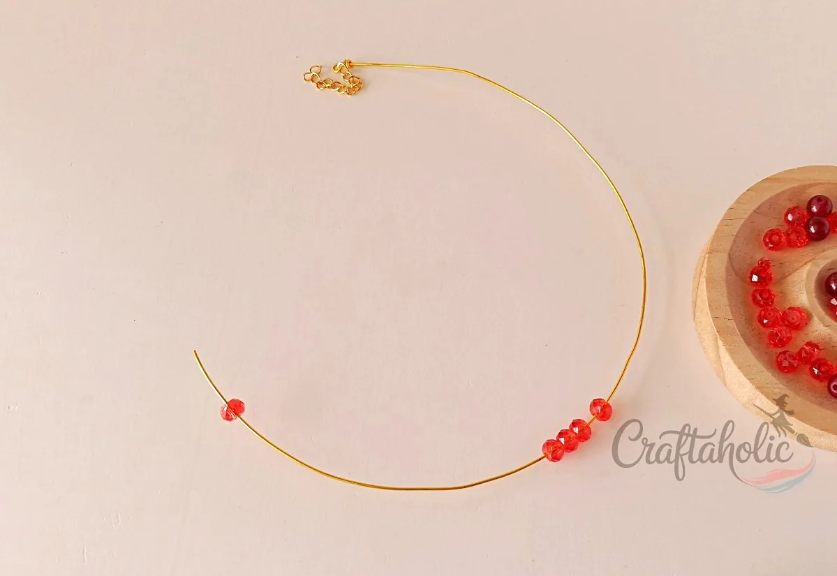 Beaded choker necklace, step 7 Inserting base beads onto the choker wire